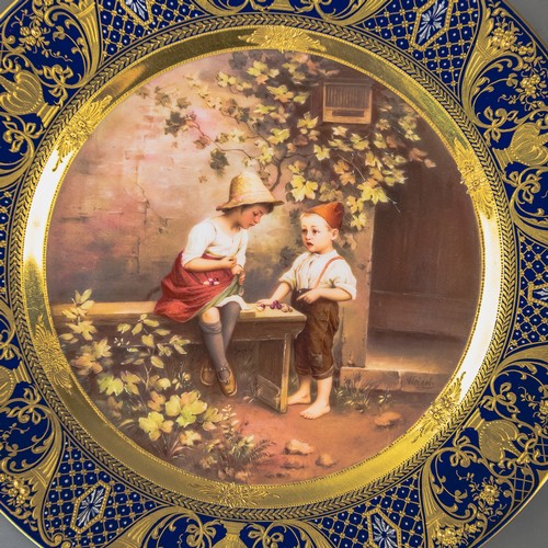 A Royal Vienna plate with a cobalt blue and gilt border, with centre ...