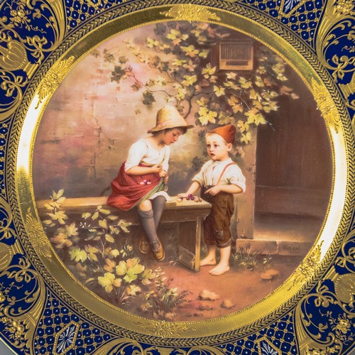 A Royal Vienna plate with a cobalt blue and gilt border, with centre ...