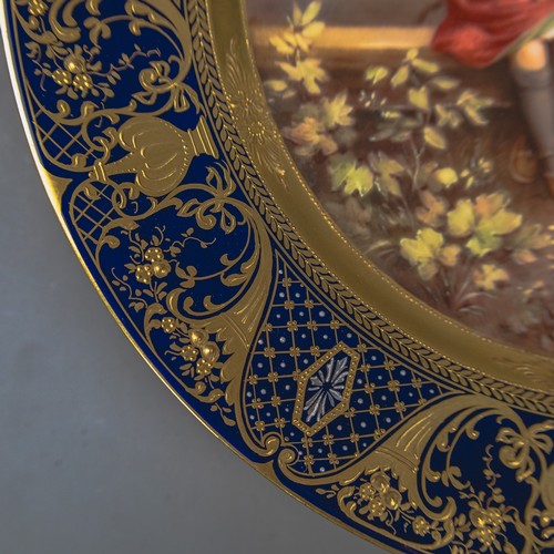 A Royal Vienna plate with a cobalt blue and gilt border, with centre ...