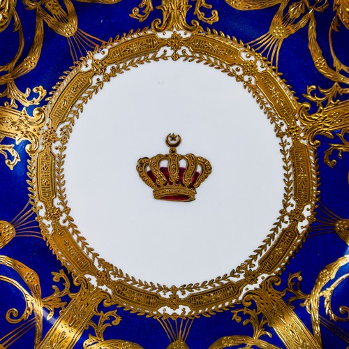 An early 20th century Sevres plate, ornately decorated with a gilded ...