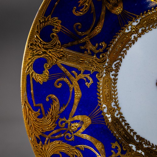 An early 20th century Sevres plate, ornately decorated with a gilded ...