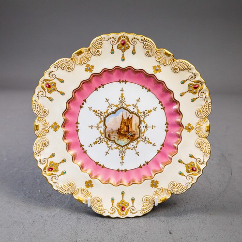 A late 19th Century Coalport plate with scalloped rim, ornately gilded ...