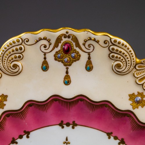 A late 19th Century Coalport plate with scalloped rim, ornately gilded ...