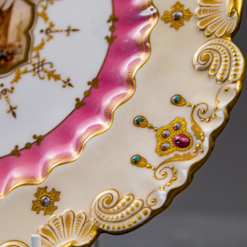 A late 19th Century Coalport plate with scalloped rim, ornately gilded ...