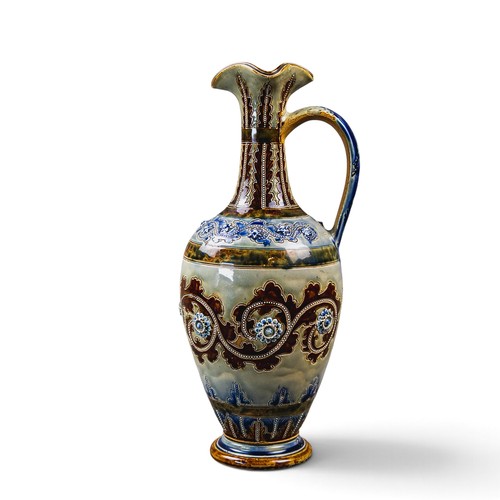 A large Doulton Lambeth ewer with a looped handle and shaped rim by ...