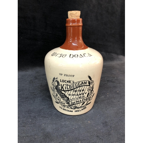 141 - Kilbeggan Irish whiskey stoneware bottle 19cm high