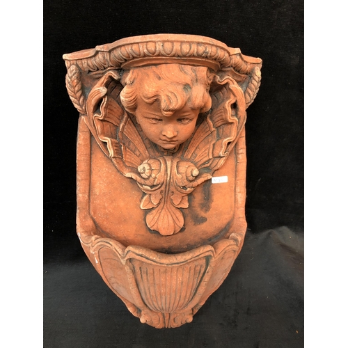 167 - Terracotta Cherub wall sconce 44cm high