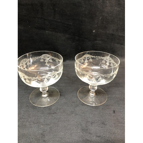 207 - Two etched glass champagne glasses, one chipped