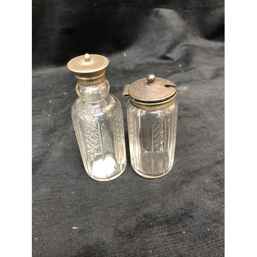 35 - Two silverplated topped glass jars tallest 14cm