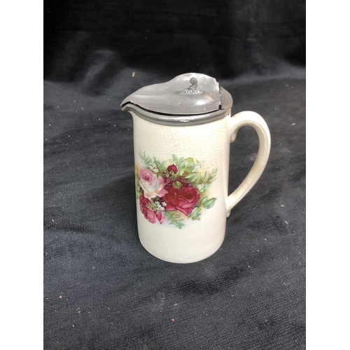 58 - Victorian pottery jug with pewter lid 16cm high