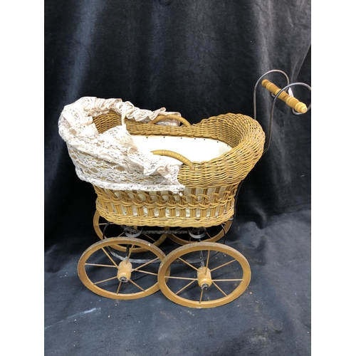 67 - Wicker dolls pram 56cm high