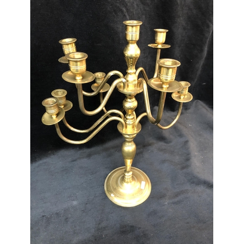 69 - Nine branch brass candleabra 44cm high