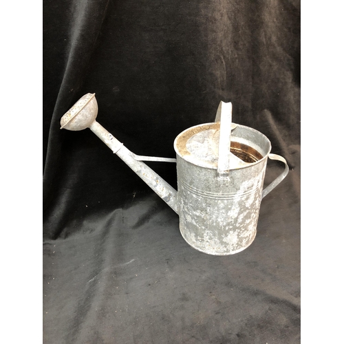 76 - Galvanised watering can