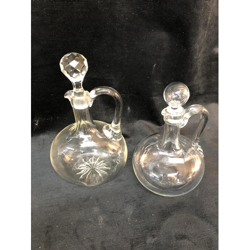 82 - Two glass decanters