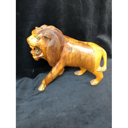 87 - Carved wooden Lion 35cm high