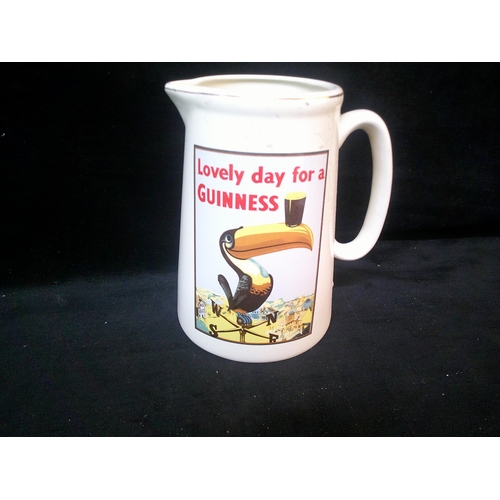 101 - Large Guinness pottery jug 22cm high