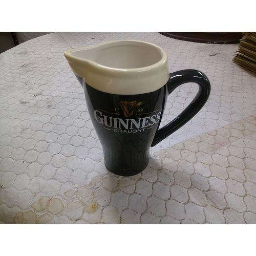 99 - Guinness pottery jug 16cm high