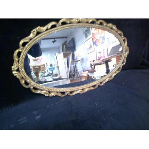 111 - Gilt framed oval mirror, 74cm X 46cm