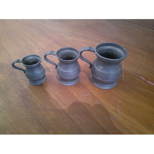 43 - Three pewter pub measures