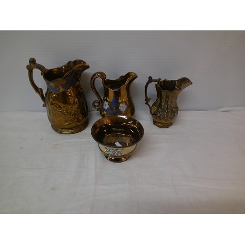 104 - Three brown lustre jugs, tallest 18cm & a brown lustre pot