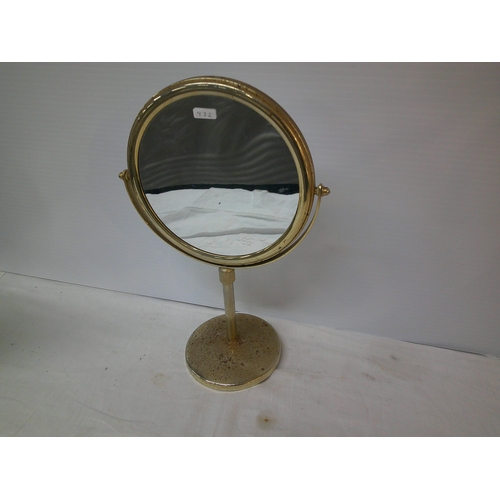 106 - Circular mirror on a brass stand 41cmH