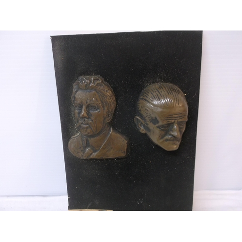 118 - Two heads mounted on a board 41cm X 24cm