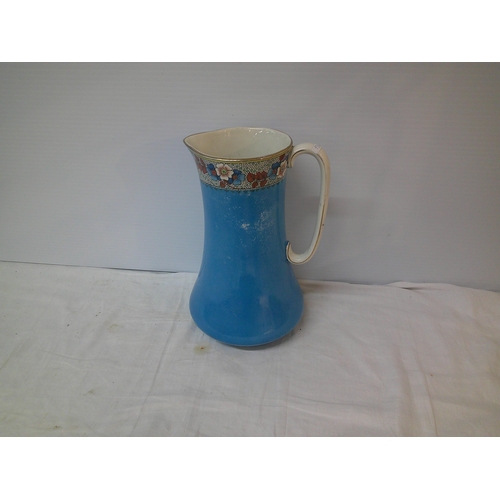 132 - Tall blue pottery jug 33cmH