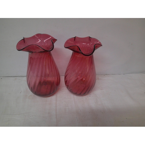 45 - A pair of red glass vases each 23cmH