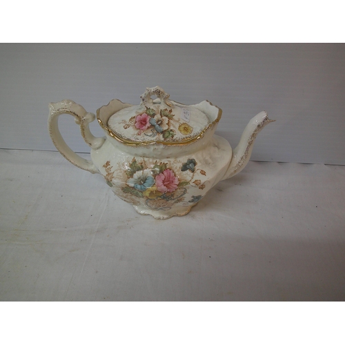 72 - A decorative pottery teapot, spout damaged