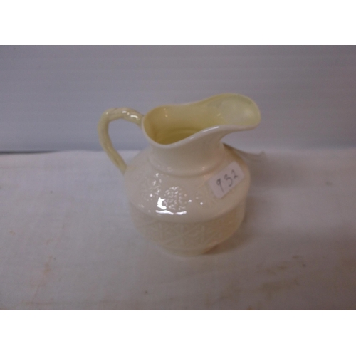 79 - A small green stamp Belleek jug 9cmH