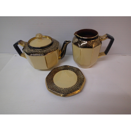 39 - Pottery teapot & milk jug