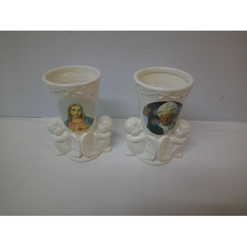 11 - Two religious candle holders each 15.5cmH