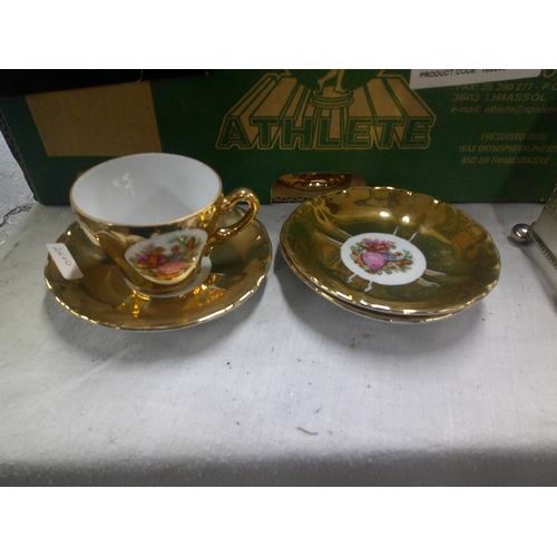 67 - Three gold gilded saucers and one cup