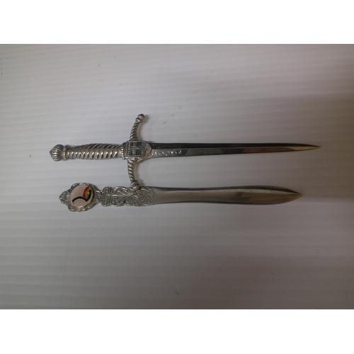 104 - Two silver plated letter openers, largest 18cmL.