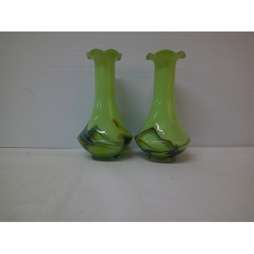 110 - A pair of green glass vases each 17.5cmH