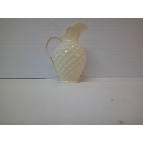 137 - A small Belleek jug 10cmH