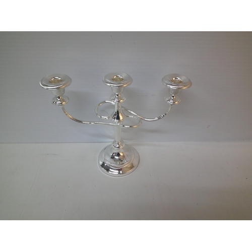 183 - A three branch silver plated candelabra