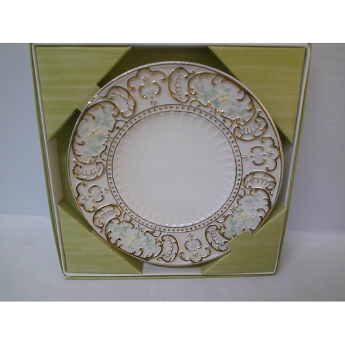 272 - A Belleek 6th period gilded plate - 22cmD