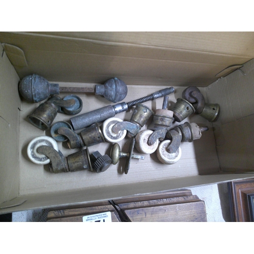 132 - A box of assorted castors etc.