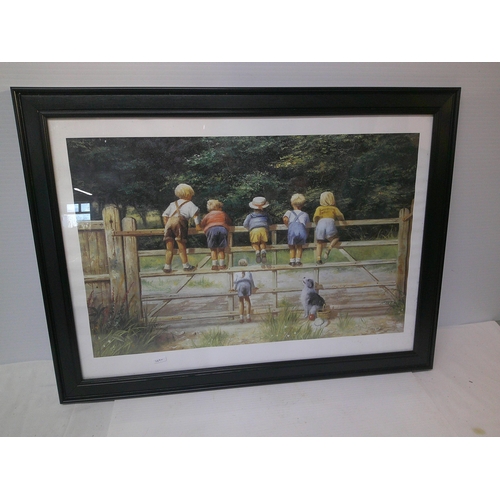 186 - A large framed picture of children - 77.5cm x 58cm