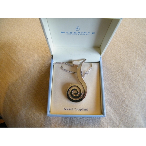 214 - A Newbridge silver plated pendant