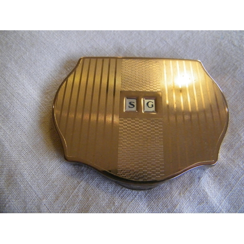 227 - A Stratton gold coloured compact