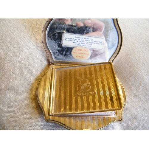 227 - A Stratton gold coloured compact