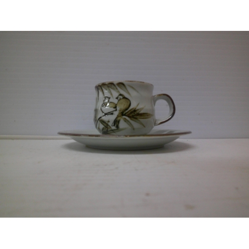 316 - A pottery cup and saucer