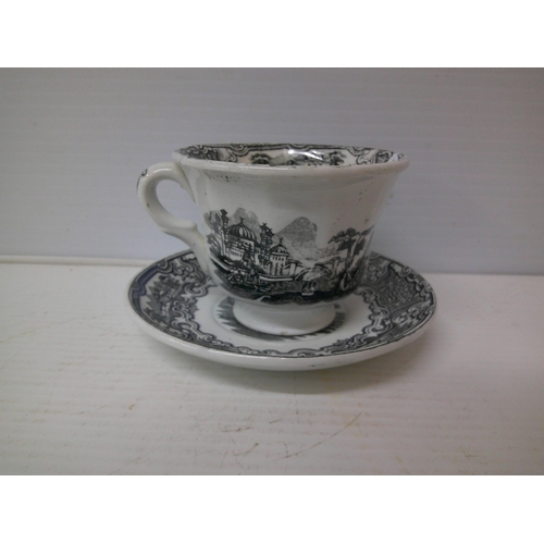 322 - A large cup and saucer