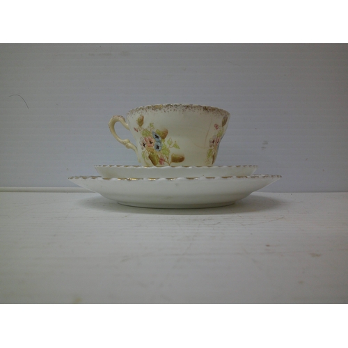 325 - A fine bone china trio