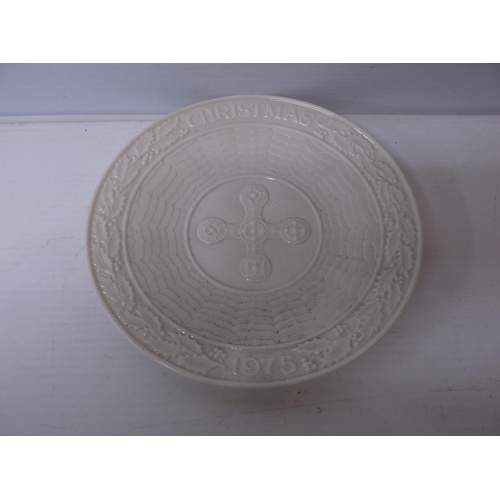 378 - A Belleek Christmas plate 1975 with a Celtic cross and a holly border 22cmD