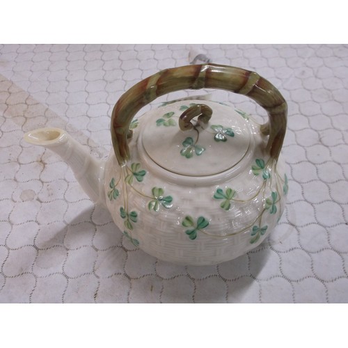 359 - A Belleek 3rd period shamrock pattern kettle, two small nibbles to spout - 17cmW x 13cmH