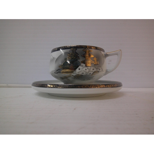 243 - A Hayasi Kutani cup and saucer with holographic Geisha