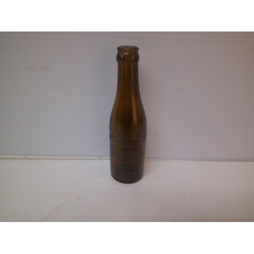 251 - A brown glass bottle Downes & Sons, Ennis - 20cmH
